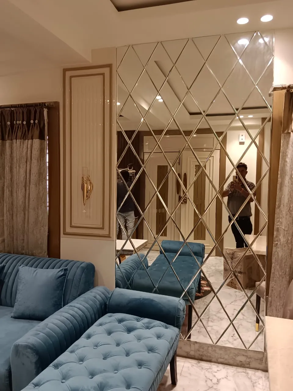 Modern home [renovation in Kolkata] with elegant interiors and [customised furniture] by Agnimitra Interior Design.